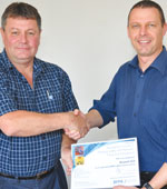 SAFPA council member Russel Gill receives the official Train the Trainer certificate from SAFPA president Norman Hall